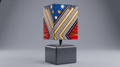 Colorful geometric-patterned lamp on a gray background