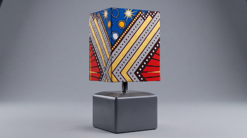 Colorful geometric-patterned lamp on a gray background
